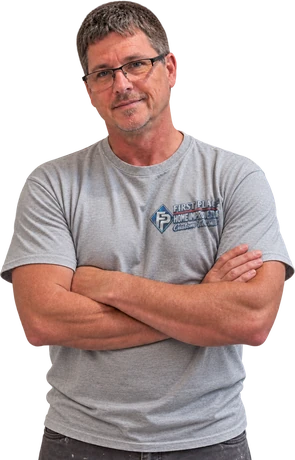 Darrell Price, owner of First Place Home Improvement, in a company shirt